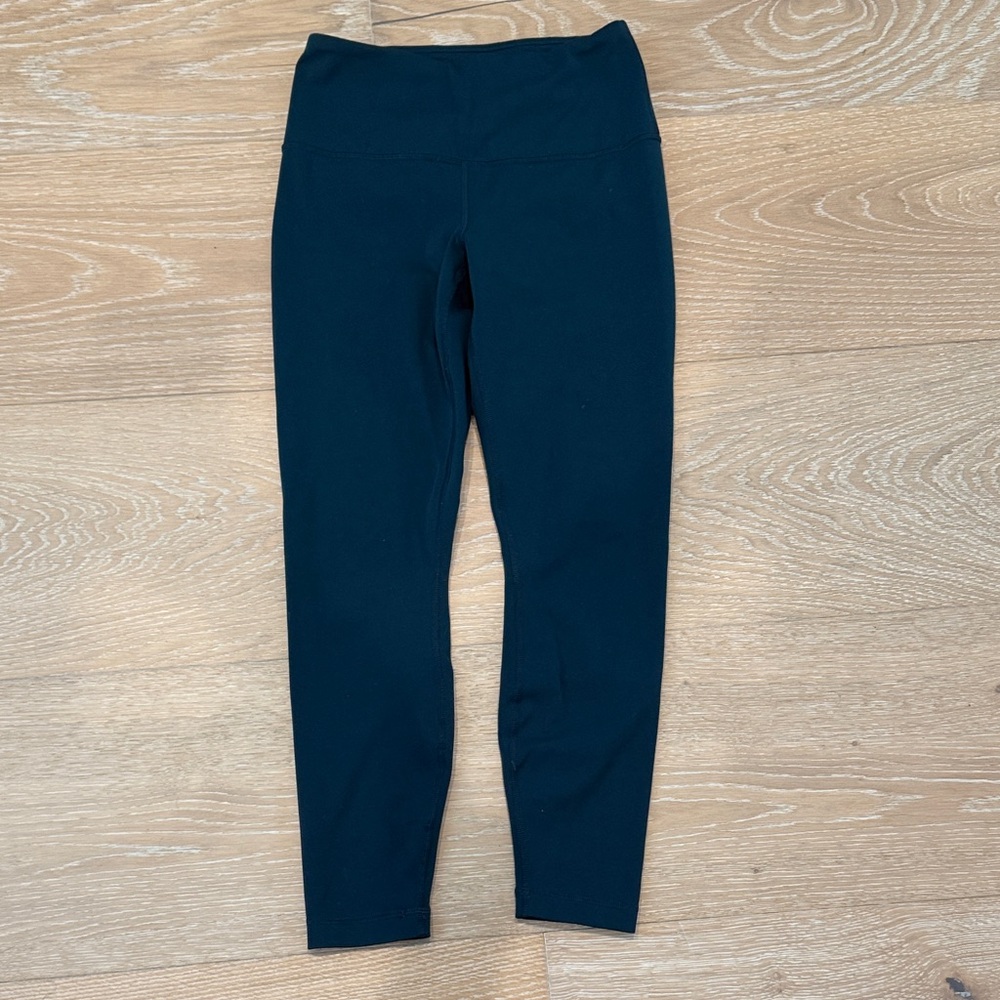Yogalicious Lux Women’s size small Leggings in a dark teal. 23”